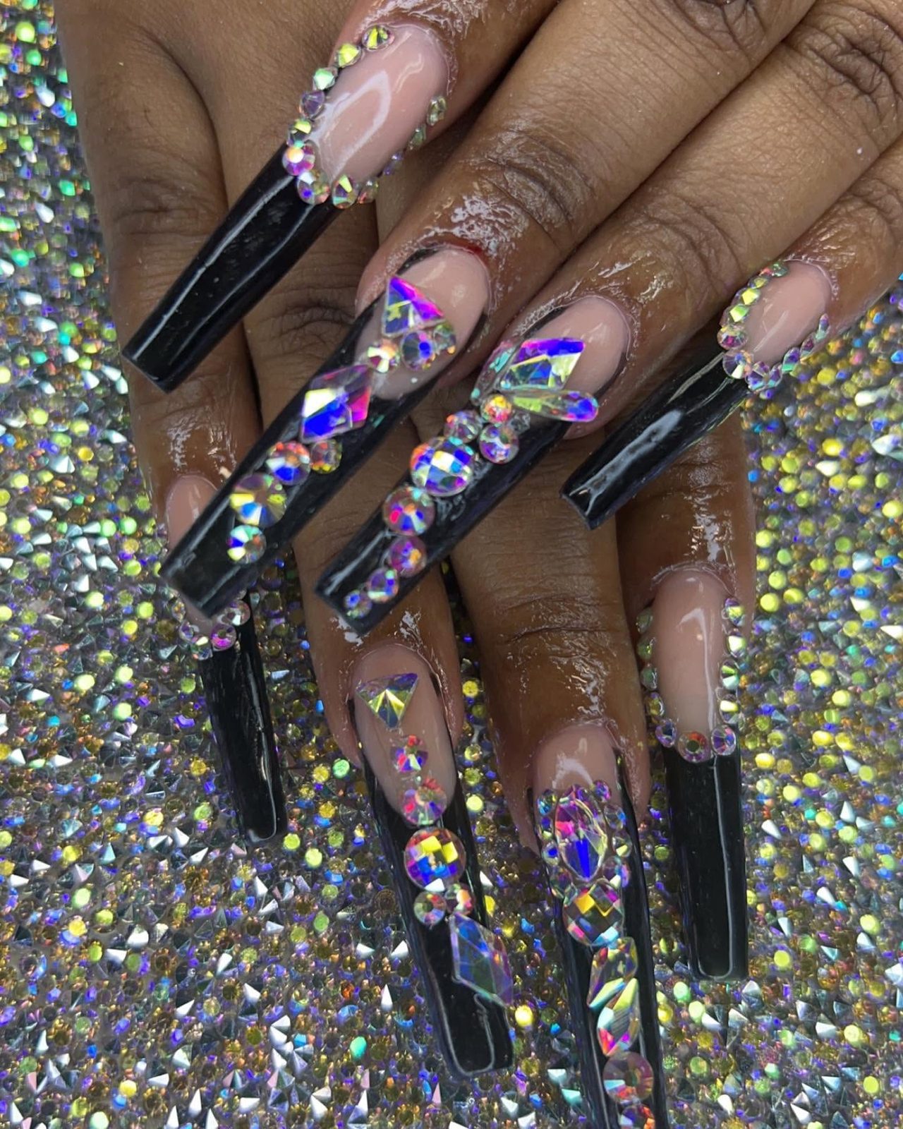 Long black coffin set with an iridescent crystal cluster