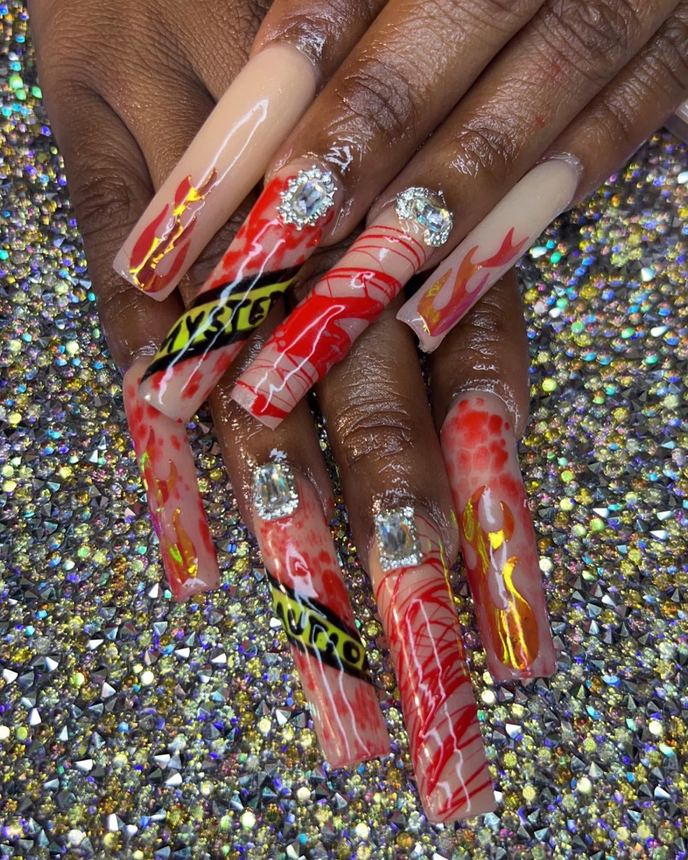 Hand-painted acrylic nail art on a holographic backdrop