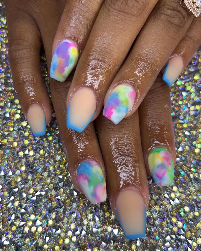 Custom freestyle acrylic set on a holographic backdrop