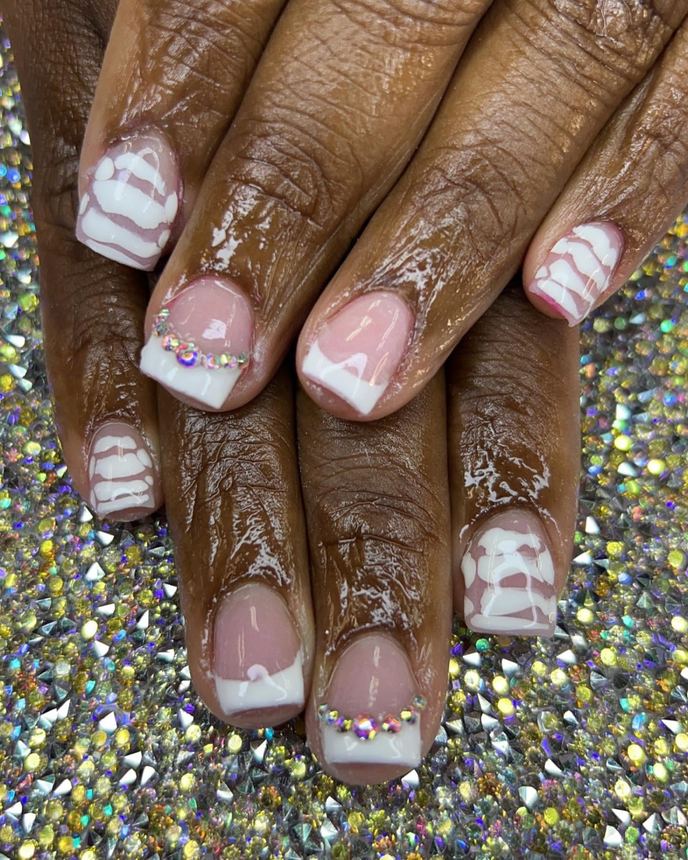French tip acrylic set on a holographic backdrop