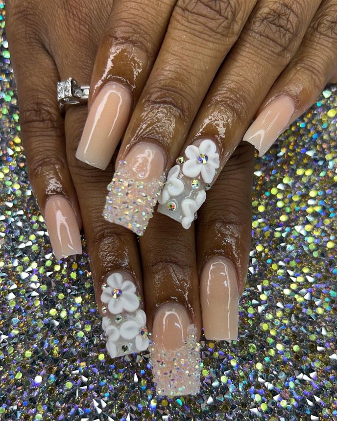 Hand-painted acrylic nail art on a holographic backdrop