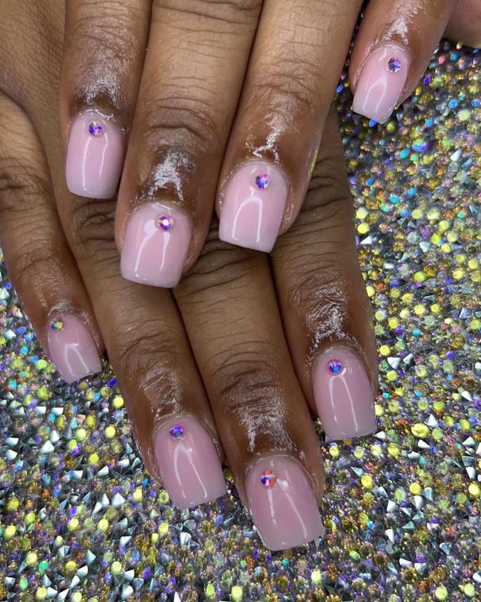 French tip acrylic set on a holographic backdrop