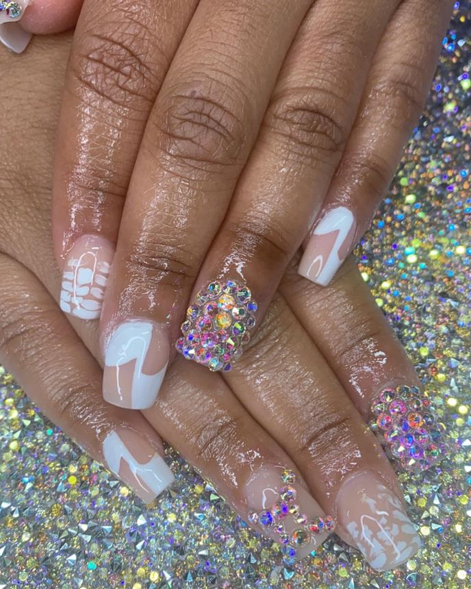 Hand-painted acrylic nail art on a holographic backdrop
