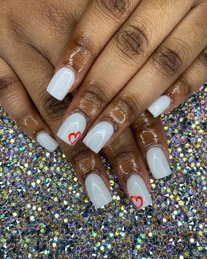 Hand-painted acrylic nail art on a holographic backdrop