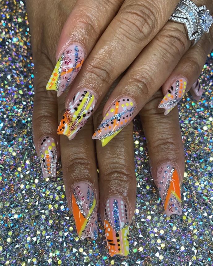Custom freestyle acrylic set on a holographic backdrop