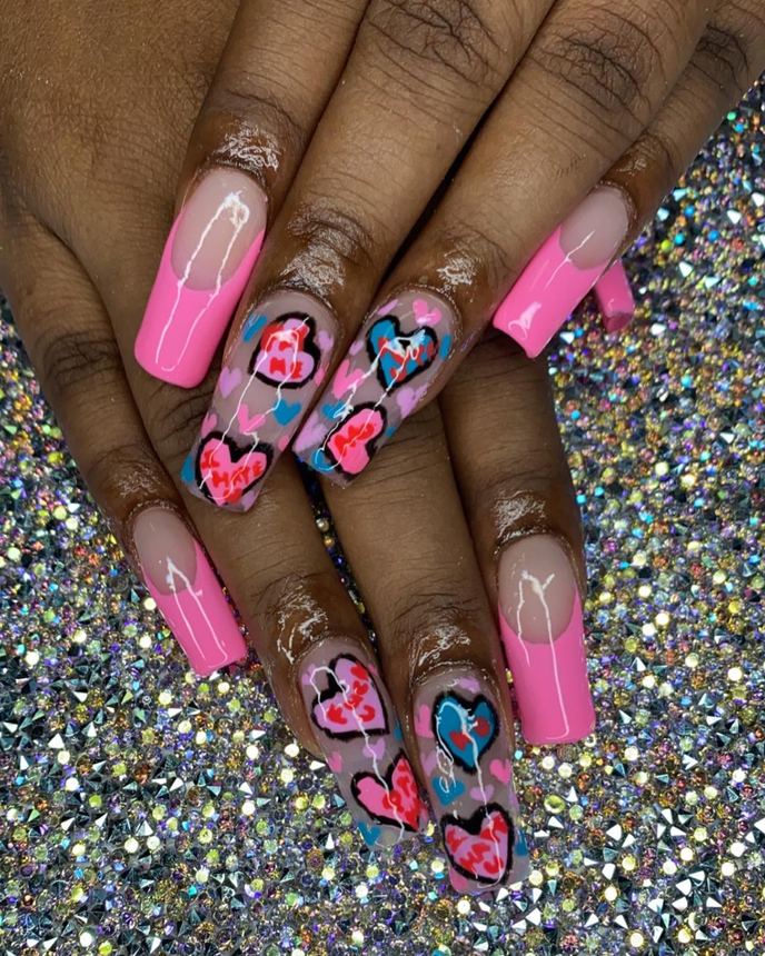 Hand-painted acrylic nail art on a holographic backdrop