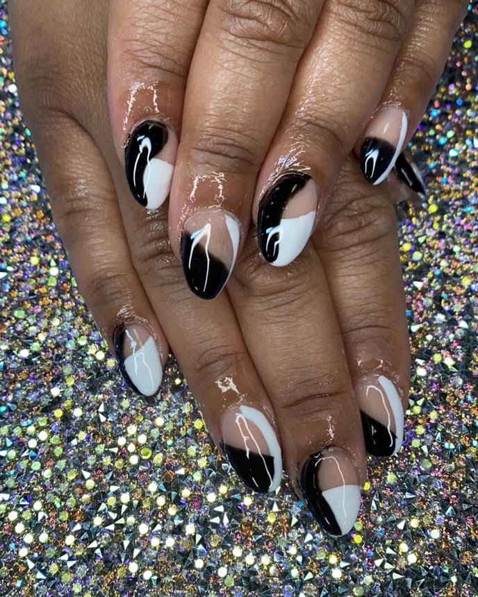 Hand-painted acrylic nail art on a holographic backdrop