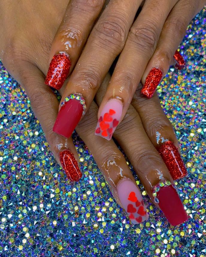Hand-painted acrylic nail art on a holographic backdrop