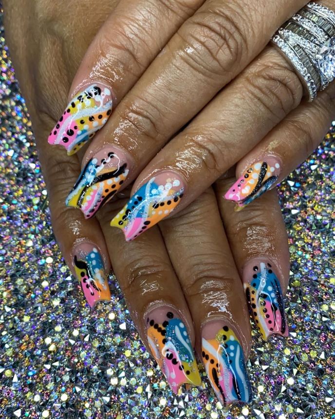 Custom freestyle acrylic set on a holographic backdrop