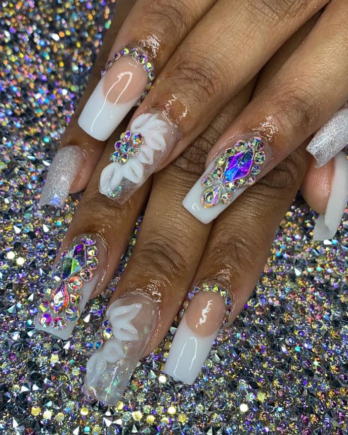 Hand-painted acrylic nail art on a holographic backdrop